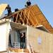 Cleanup workers remove debris on March 16, 2012, and reinforce a house damaged by a tornado that hit the Huron Farms neighborhood. Angela J. Cesere | AnnArbor.com
